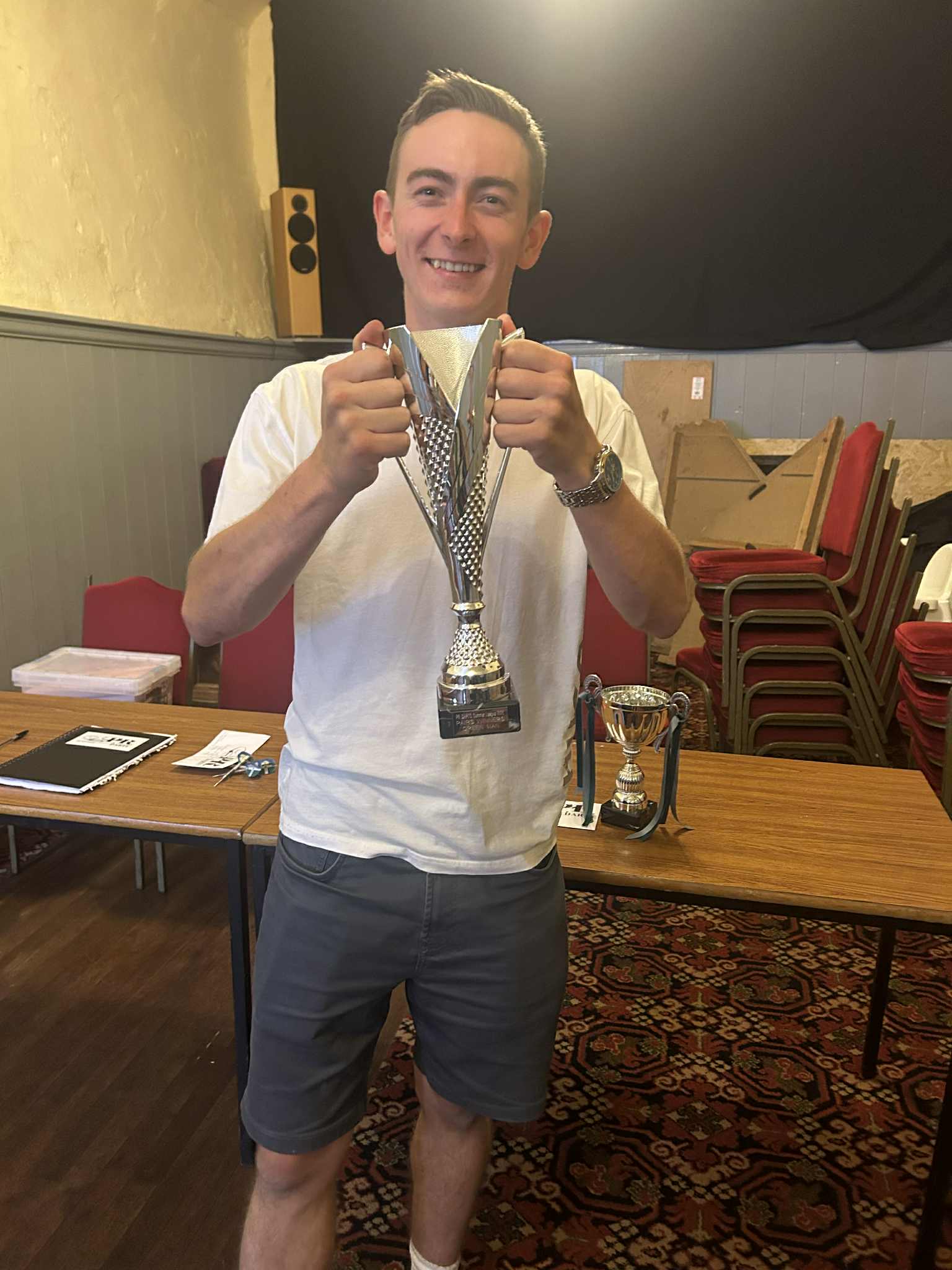Luke Mason with multiple medals and trophies