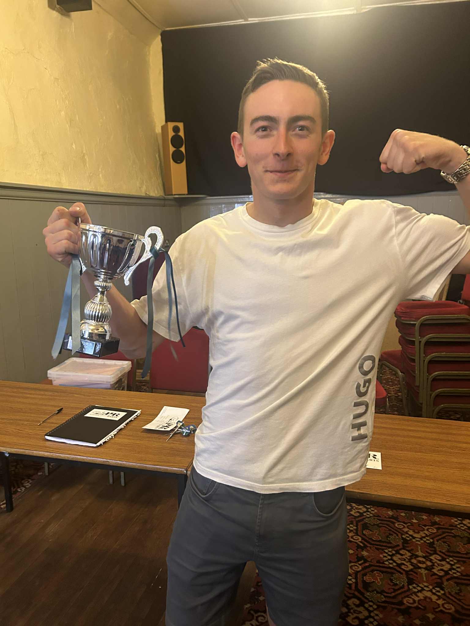 Luke Mason celebrating victory with trophy